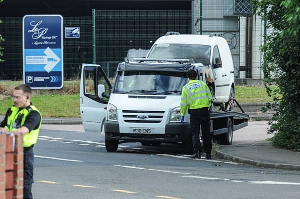 South Yorkshire Police officers working at the scene of a road traffic accident in Grimethorpe, Barnsley.