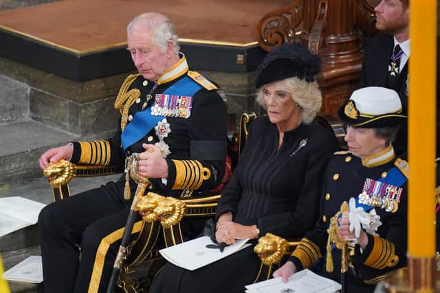 King Charles III, the Queen Consort and the Princess Royal in front of the coffin of Queen Elizabeth II during her State Funeral at the Abbey in London. Picture date: Monday September 19, 2022.