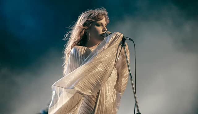 Riley Keough as Daisy Jones in Daisy Jones & The Six, performing in a style reminiscent of Stevie Nicks (Credit: Lacey Terrell/Prime Video)