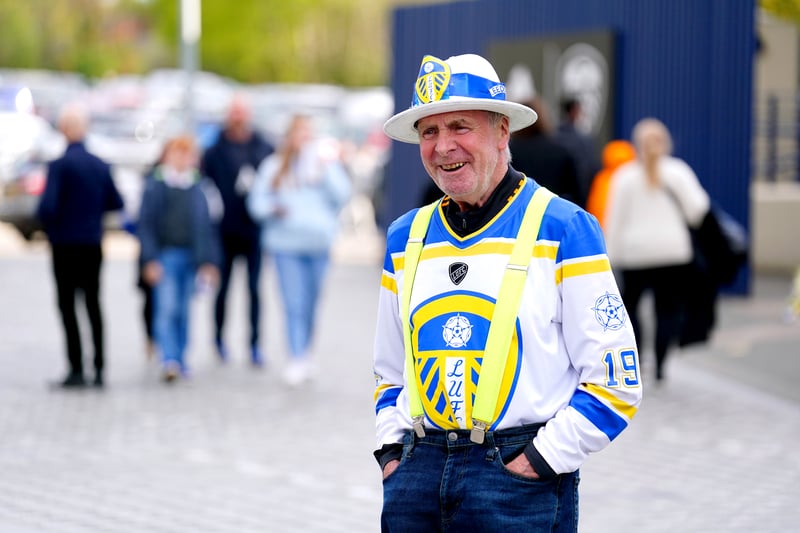A Leeds United fan arrives at the stadium ahead of the Premier League match at Elland Road