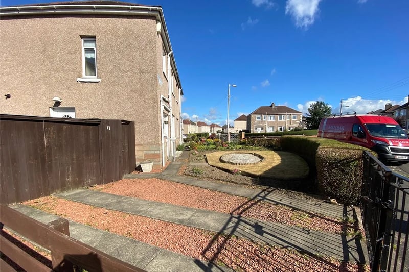 The sub-divided driveway and front garden 