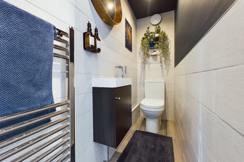 The downstairs guest WC with hand wash basin and toilet. Photo: Zoopla