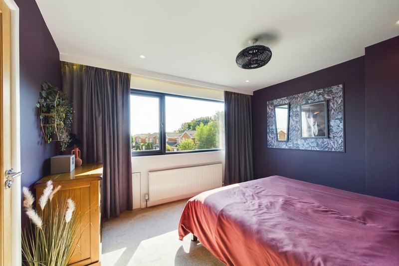 The spacious master bedroom with its own ensuite bathroom and large windows. Photo: Zoopla