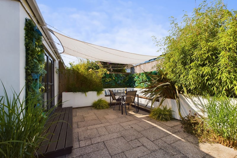 The impressive rear garden patio has space for lots of furniture. Photo: Zoopla