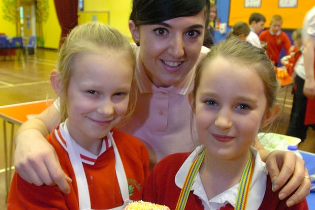 Masterchef finalist Stacie Stewart passed on baking skills to the Cookery Cub at Willowfield Primary school, Witherwack in 2011.
Yenna Cunningham (left) and Rachel Watson benefited from Stacie's advice.