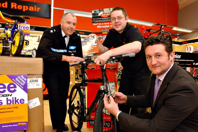 PC Graeme Anderson was pictured putting a microdot security device on a bike at Halfords.
Joining him was Inspector John Parish and deputy store manager Mark Middleton watching in 2004.
