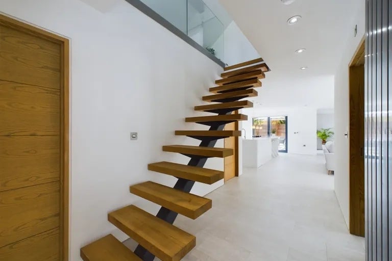 These unique stairs will take you up to another living room and a bedroom. (Photo courtesy of Zoopla)