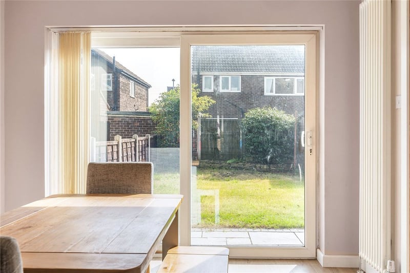 The dining area has a view out on the rear garden.