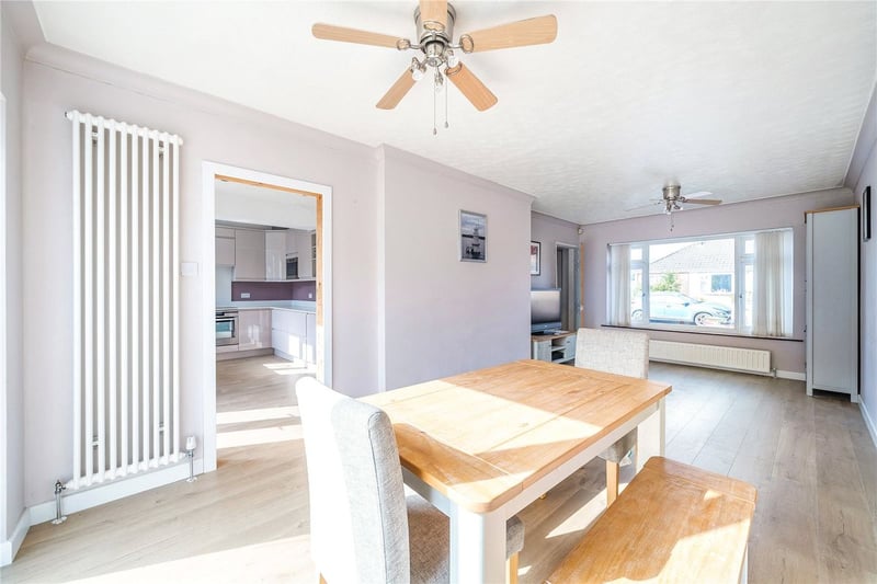 The open dining room and lounge with large window to the front.