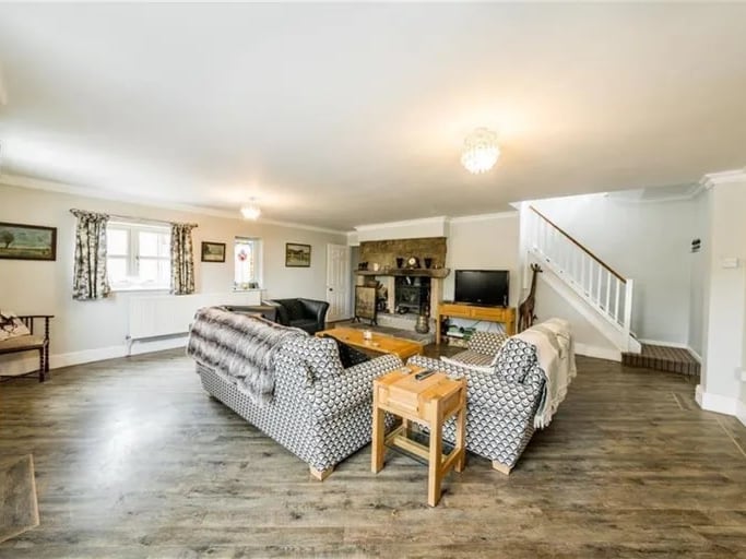 Just through from the open plan space is this large sitting room. (Photo courtesy of Zoopla)