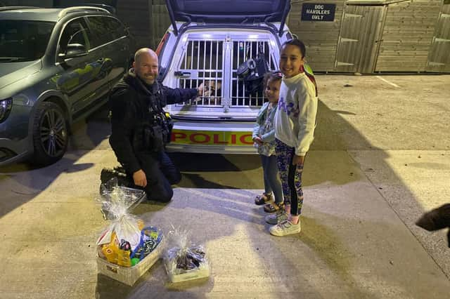 Ayla and Alanna with PC Dan Radford and Chase during their visit. (Photo courtesy of South Yorkshire Police)