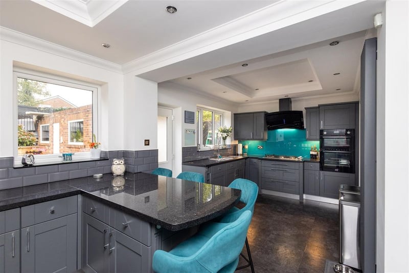 The modern breakfast kitchen with integrated appliances and base and wall units.