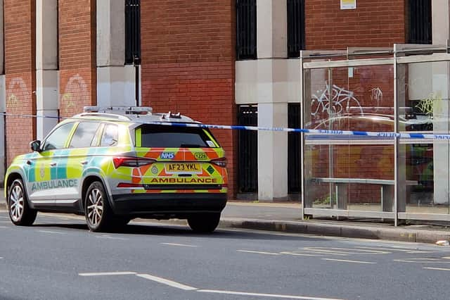 Paramedics  and police are on the scene at the bottom of the Moor, Sheffield, after a suspected stabbing. Picture: David Kessen, National World