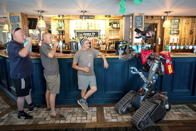 Johnny 5 robot is also a pub regular who appears to enjoy sinking a nice cold pint and putting the world to rights at his local boozer