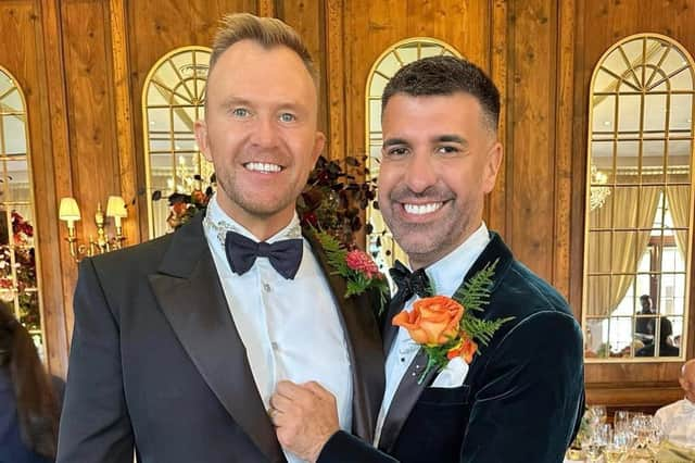 Dan Hatfield with his husband, Joff Powell