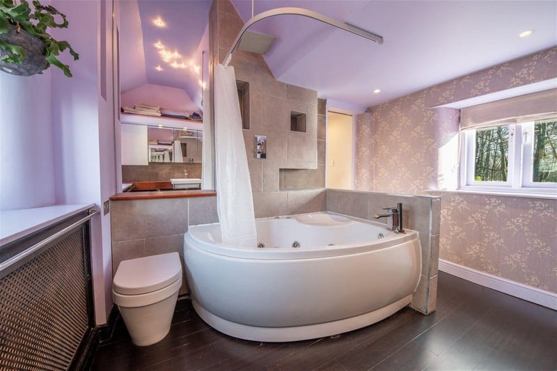 The en-suite bathroom has a bath and overhead shower. Photo courtesy of Zoopla