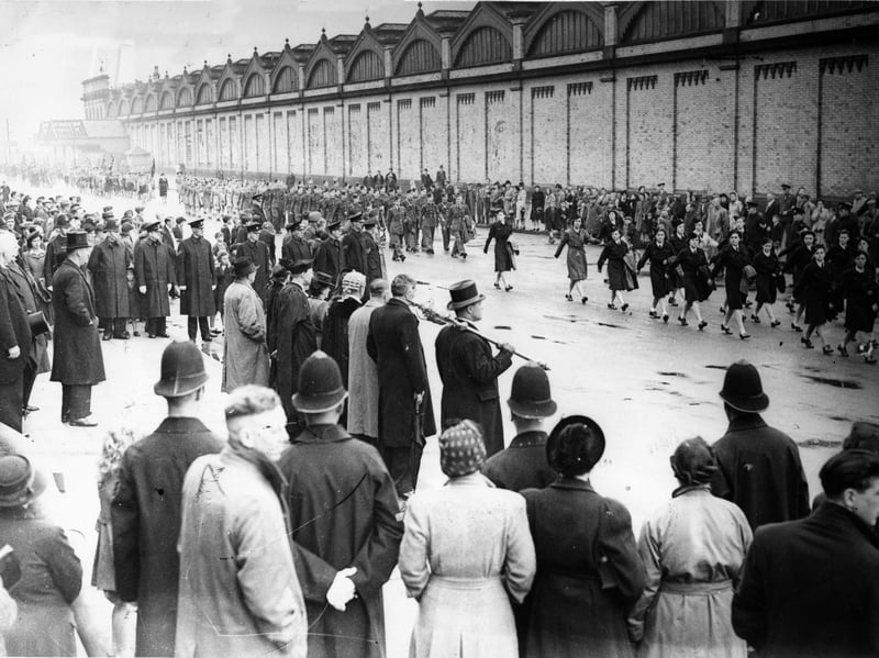 Fleetwood's VE Day parade marches past the Mayor
In the background is the old Fleetwood railway station,