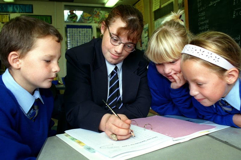 Pupils at Collegiate School are being paid to tutor youngsters at Layton Primary School as part of a scheme pioneered in America.
Pic shows 13 year-old Nicola Fowler helping three of her tutor group, L-R: Mark Rushton (8), Gemma Roskell (9) and 8 year-old Amelia Wright.