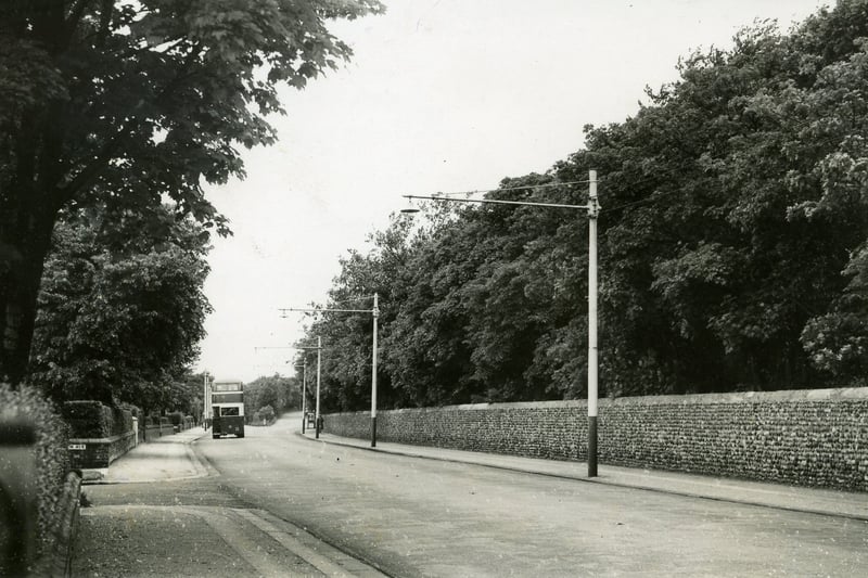 Church Road, Lytham photographed in 1951. This section of cobbled wall which at one time marked the boundary of the Lytham Hall estate, stretches the full length of Church Road and Blackpool Road