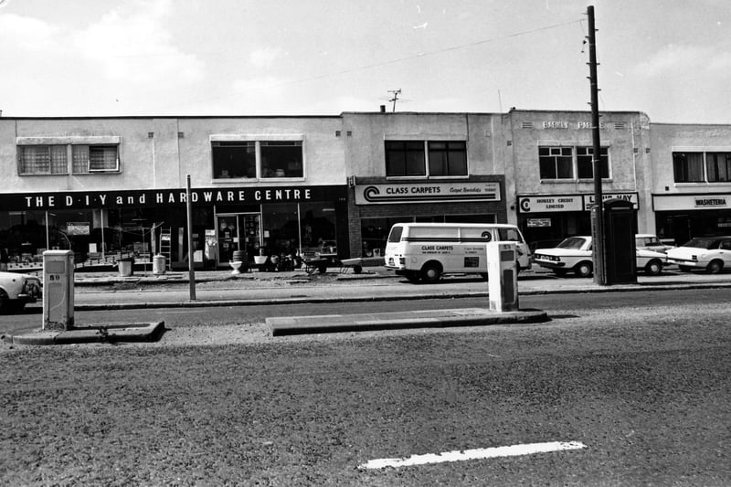 A parade of shops on Dewsbury Road pictured in July 1980. On the left is a double fronted D.I.Y and hardware centre. Next number 386, this is Class Carpets, business of Mr. K. Jones. Moving right a credit lending service, then a washeteria laundrette.