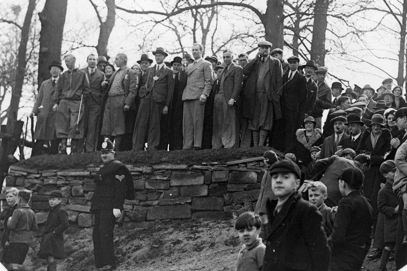 Crowds at the opening ceremony of Gotts Park Golf Course, to be performed by the Lord Mayor, Alderman Robert Holliday Blackburn JP, who is seen in the centre of the group gathered at the top. A policeman is keeping order below. Pictured in April 1933. 