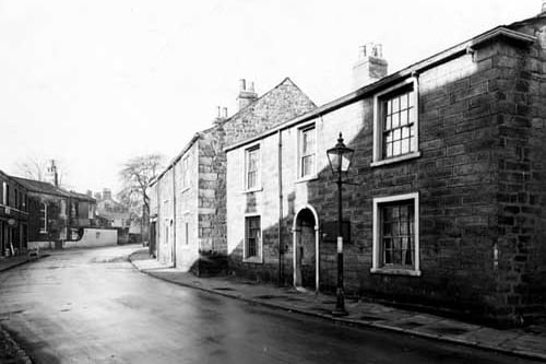 Town Street in November 1949. A gas street lamp is prominent. A pram is just visible down the road.