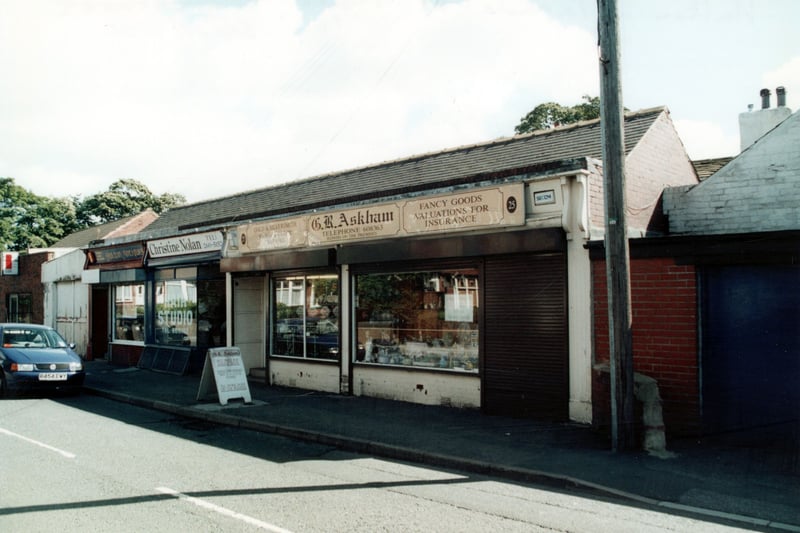 Small parade of one storey shops to right of Chapel Street looking north east. The shops are from right to left G R Askham, gold and silversmith, Christine Nolan hair studio and Halton Antiques. Pictured in September 2000.