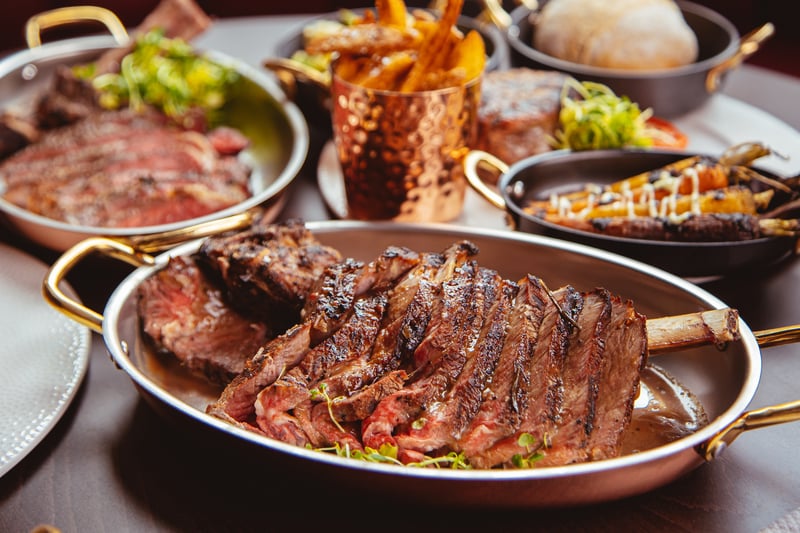 Go for a steak to share at Merchant Steakhouse which is grilled over oak charcoal on their custom Parrilla Grill. 56 Ingram St, Glasgow G1 1EX. 