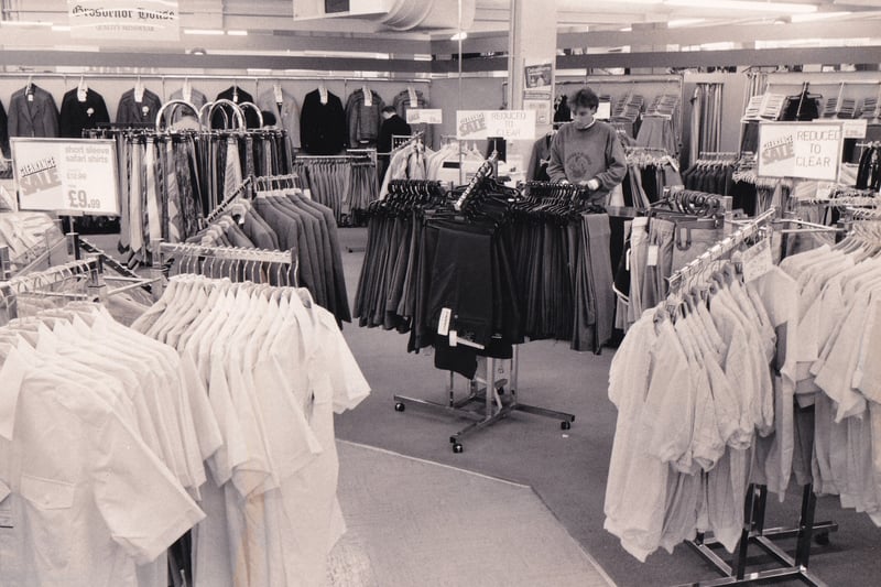Packed displays of men's clothing at Debenhams in August 1986.