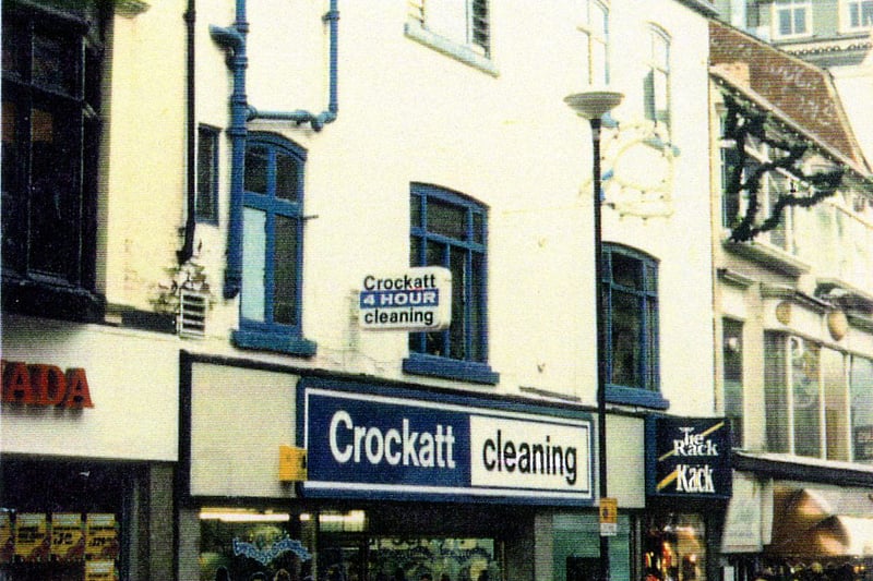 Commercial Street, showing Crockatt Dry Cleaners and Tie Rack at No.2, and on the left Granada TV & Video at No.3.