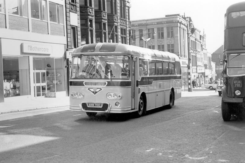 A single deck bus, an AEC Reliance 470/Roe 10 taken in September 1965. Registration no ANW 710C, no destination is displayed, logo Leeds City Transport. This is Briggate, just behind the bus on the left is the Junction with Duncan Street. 