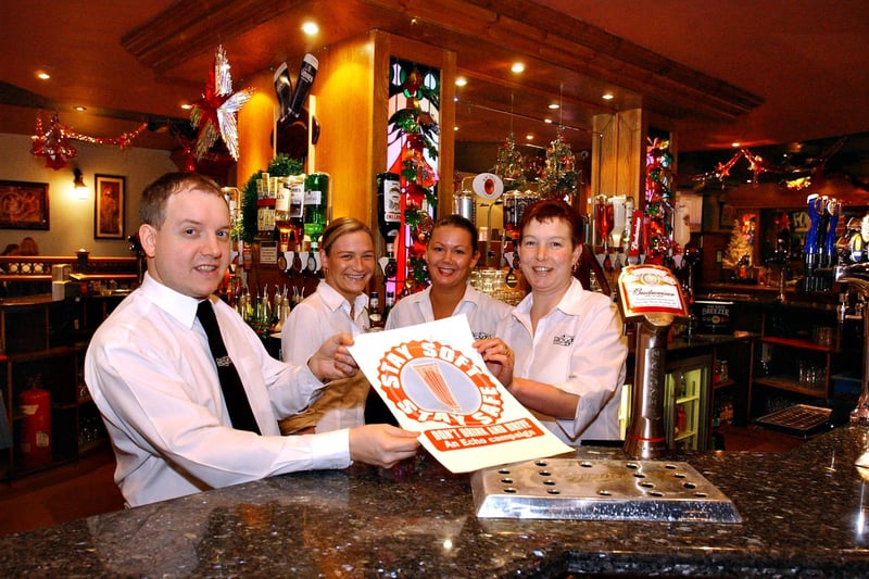 Staff at Brogans were promoting soft drinks in this scene from 2003.