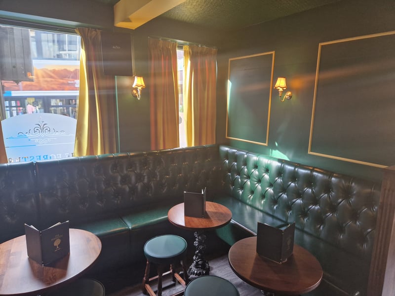 Upholstered seating inside The Foresters pub on Division Street, in Sheffield city centre