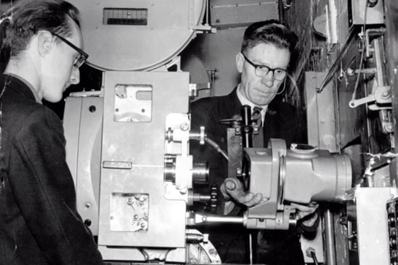 The projectionist at the Lyceum Picture House, George Bean, right, as he positions the lens. He had worked at the Lyceum Picture House in Cardigan Road for many years, from the early 1920s.