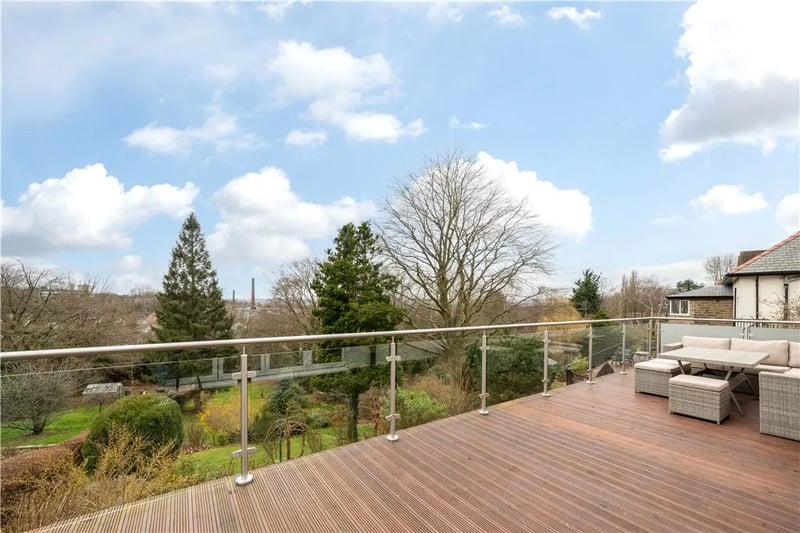 The balcony features a decking area for sitting out and enjoying the stunning city views.