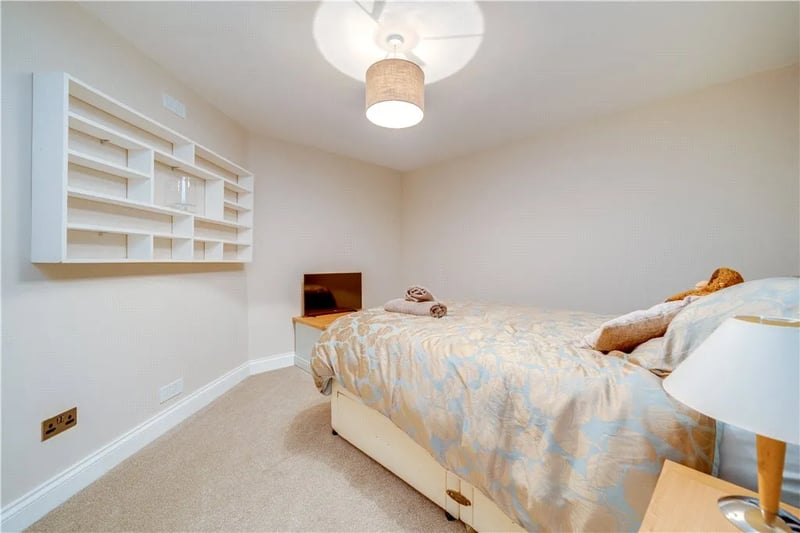 The third bedroom features built in display shelves perfect for storage.