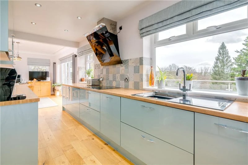 The modern open plan kitchen connects with the dining room and second living room.