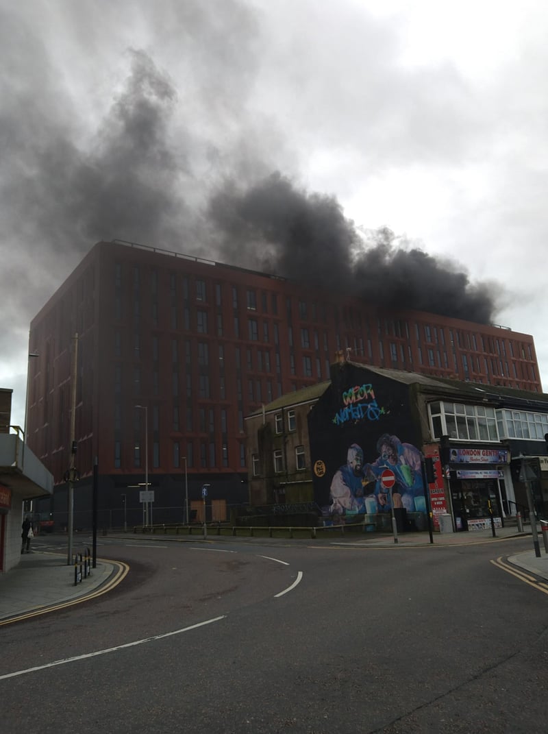 Thick black smoke can be seen rising from the under construction civil service offices in Talbot Gateway this morning