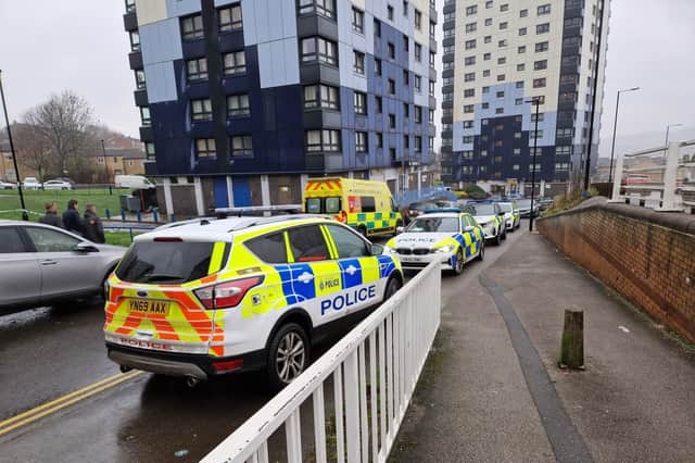 Emergency services outside a tower block on Brightmore Drive, in Netherthorpe, Sheffield, after a woman was found dead in December 2023. Sheffield Council says it has written to all high-rise residents following her death and that of another woman at a tower block in Upperthorpe in July 2022.