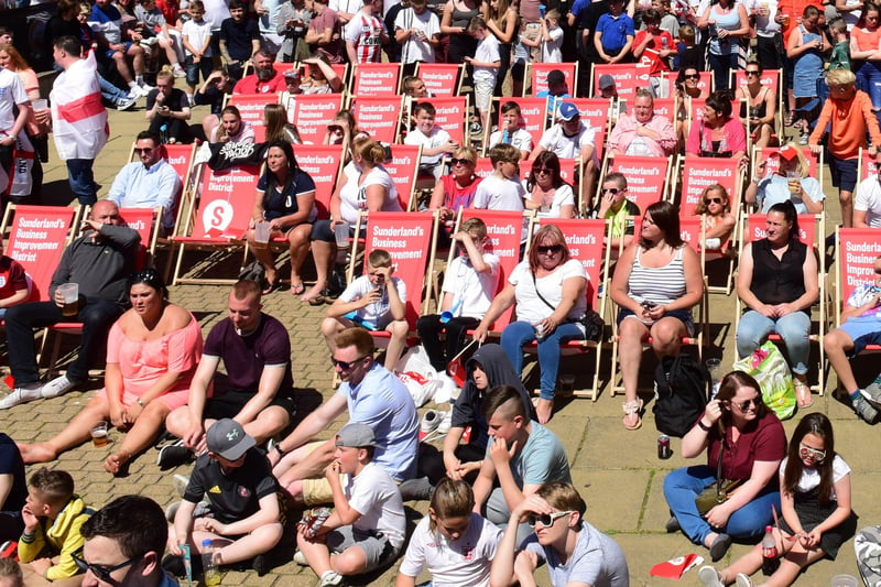 What a way to spend the day. Supporters relaxing before the action begins on the big screens in Low Row.