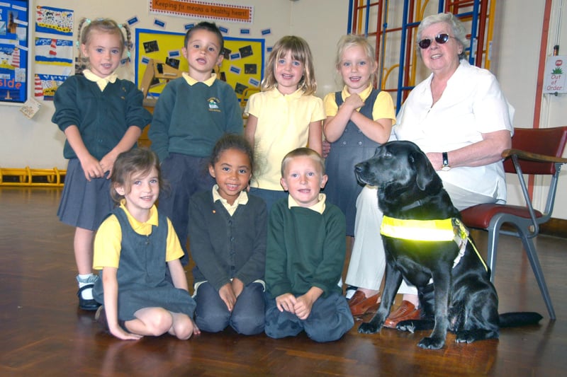 Tumble the guide dog made these children so happy at Hasting Hill Primary School in September 2007.
She was there with her owner Mavis Brennan.