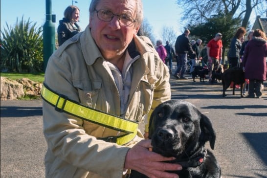 Derek Ridley with his guide dog Jen who led off the Dogs Unite sponsored walk in Barnes Park in April 2016.