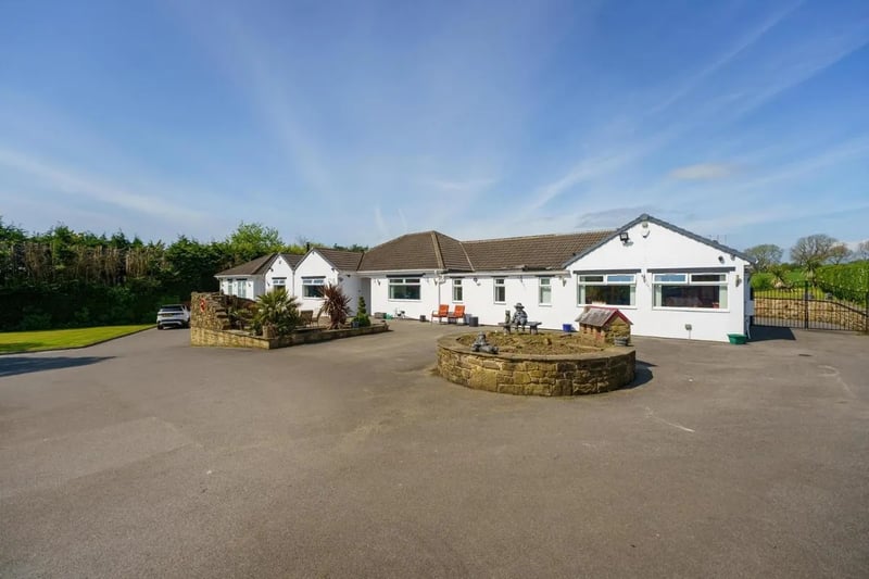 This luxury home in Bramhope comprises more than 5,000 square feet, has space for 12 cars and enviable views over the rolling countryside.