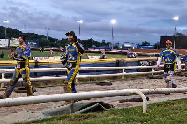 Sheffield's Kyle Howarth, Chris Holder, and guest Rory Schlein, salute the crowd after Sheffield's 50-40 win over Leicester at Owlerton. Photo: National World