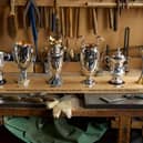 British Silverware was hired by the club’s owners to craft sterling silver cups to mark Jurgen Klopp's winning ways.
From left: League Cup, European Super-Cup, Premier League, Champions League, FA Cup and World Club Cup.
