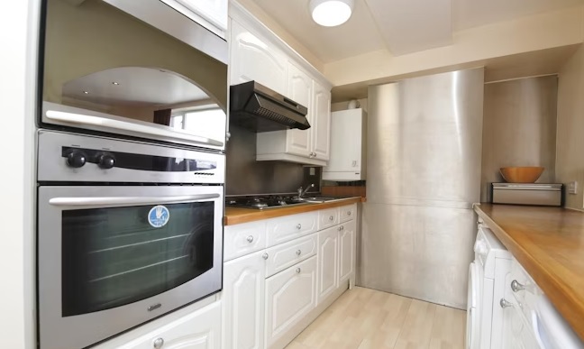 The apartment boasts a spacious and well equipped kitchen