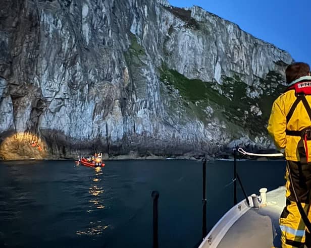 Holyhead and Trearddur Bay crews attending the injured climber from Sheffield on Saturday night. Credit: Holyhead RNLI