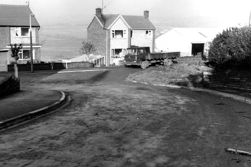 Well Garth Bank seen from Whitecote Lane, probably taken in the 1960s when this street of detached and semi-detached houses was newly built, on the site of Well Garth Farm.