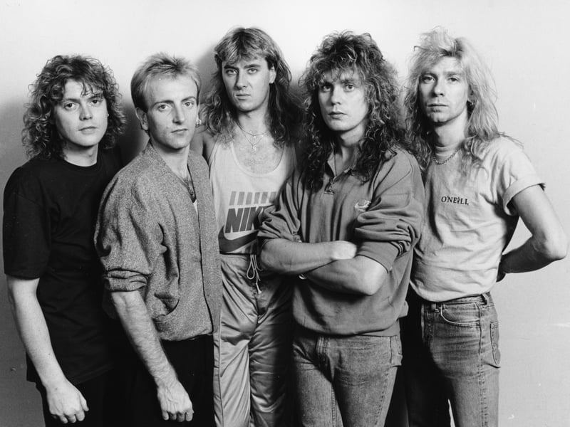 Def Leppard might never have existed had an 18-year-old Joe Elliott not missed his bus one day in the autumn of 1977. Walking home, he met a 19-year-old Pete Willis and asked if he could join Willis' newly-formed band, Atomic Mass, which also included drummer Tony Kenning and bassist Rick Savage. That band would become Def Leppard.