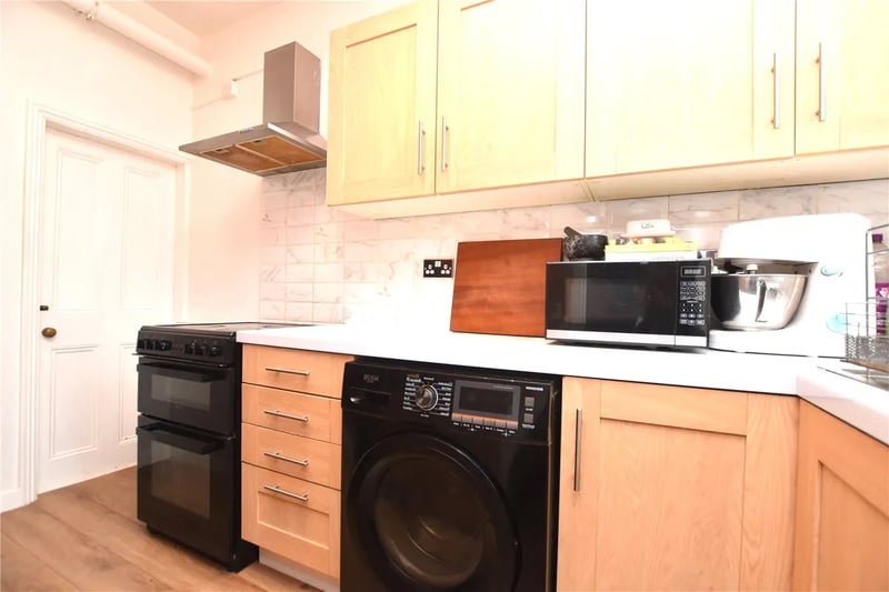 The charming fitted kitchen includes a range of wall and base units with space for a washing machine, fridge freezer and cooker as well as access down to a cellar.
